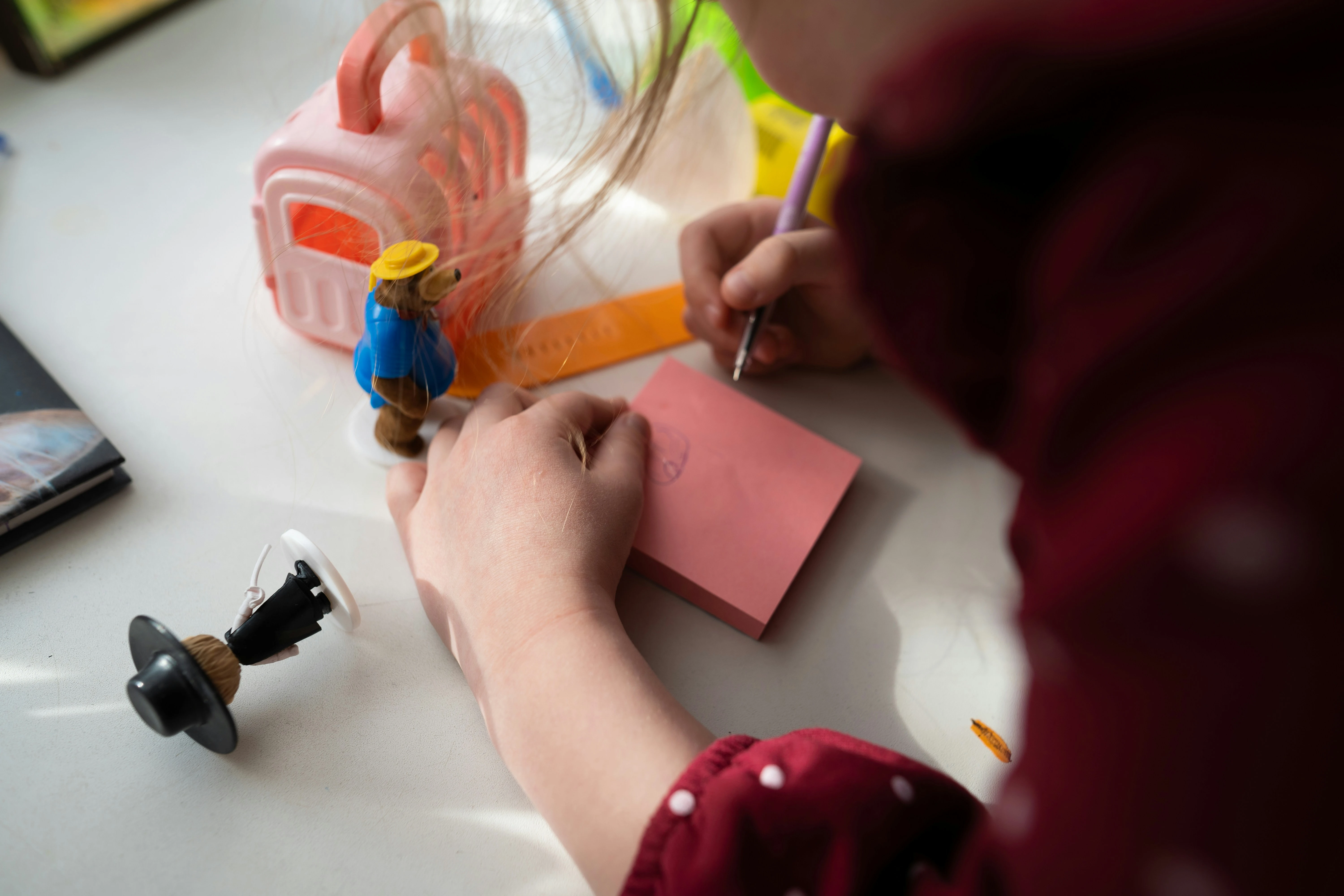 A child drawing carefully — deep in creative play